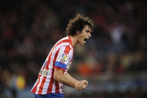 Atletico Madrid's Tiago Cardoso Mendes celebrates after scoring at the Vicente Calderon stadium on January 13, 2012